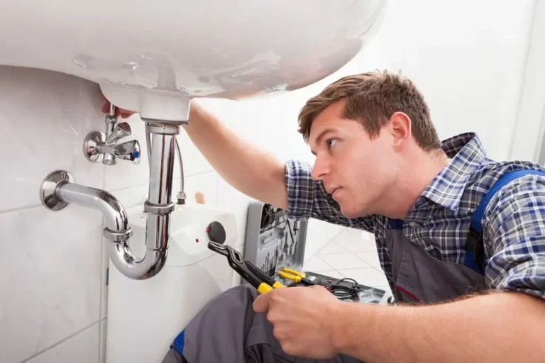 High-tech water leak detectors placed under a sink, detecting moisture and preventing potential water damage in a modern home.
